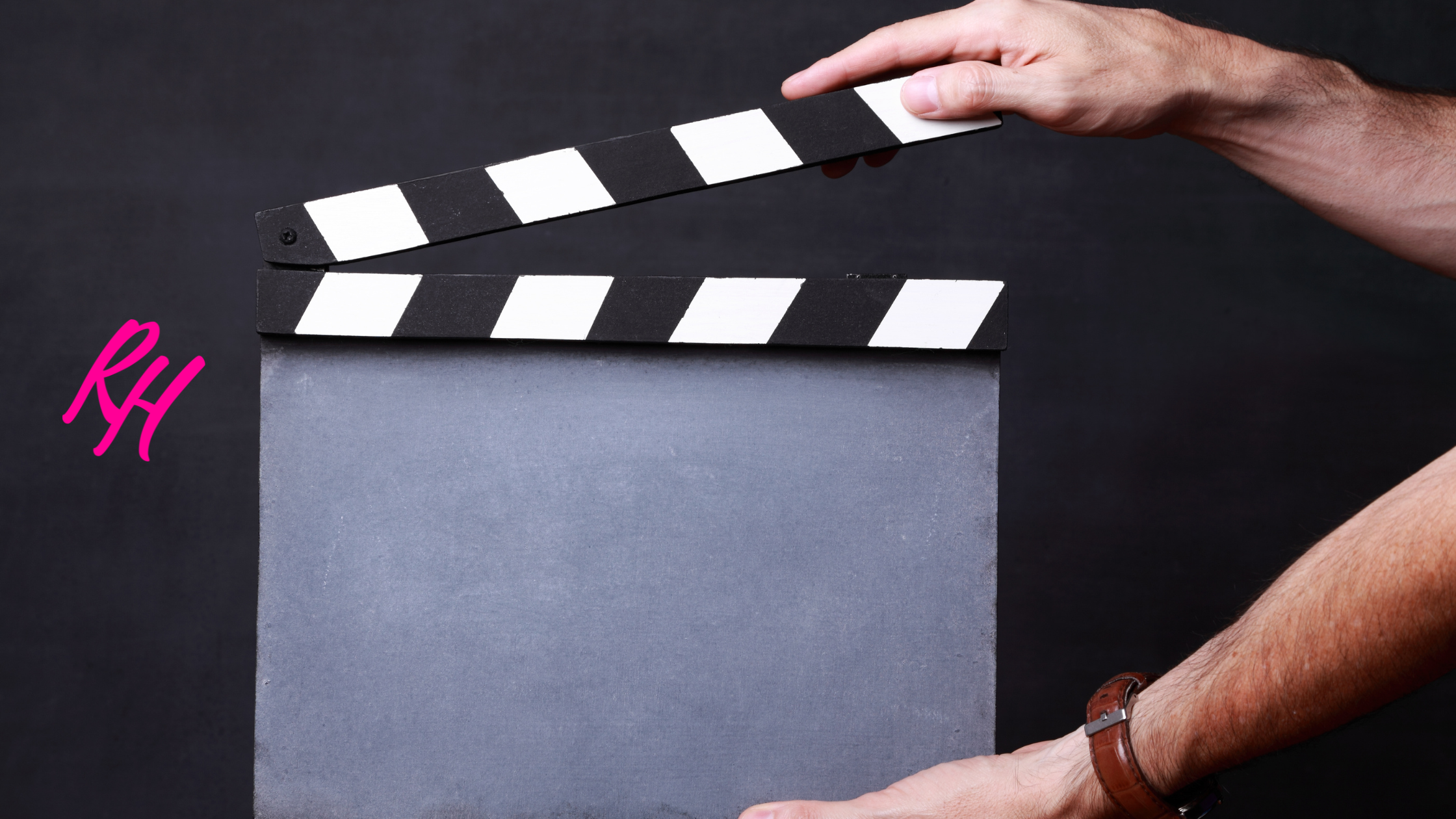 a person holding a clapper board