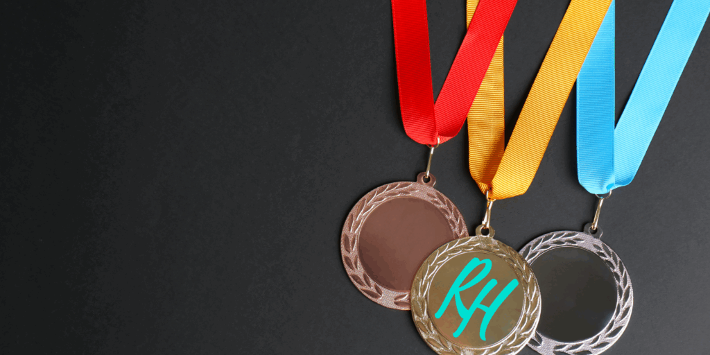 a group of medals with ribbons