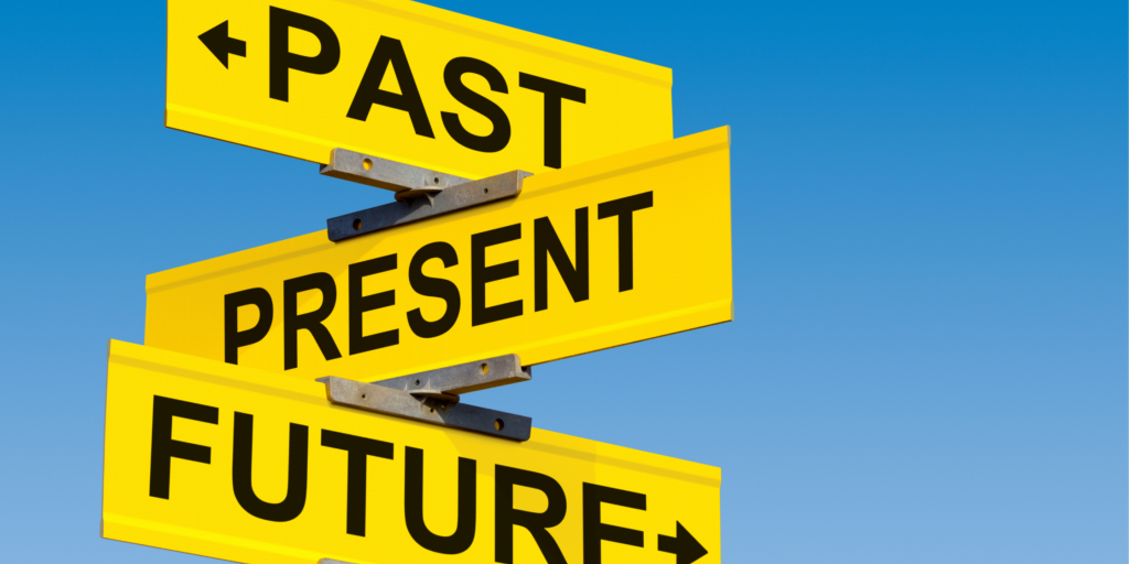 Sign showing past present and future arrows